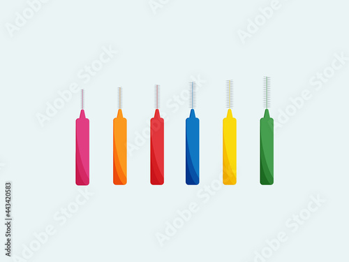 A set of interdental brushes of different colors and sizes for the care of dentures, implants and braces