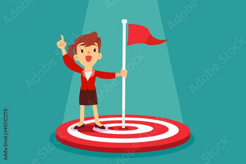businesswoman holding flag in the middle of target