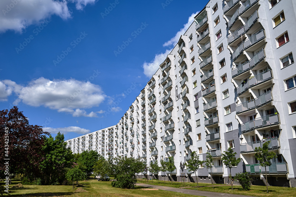 Park and multi-storey residential building with balconies