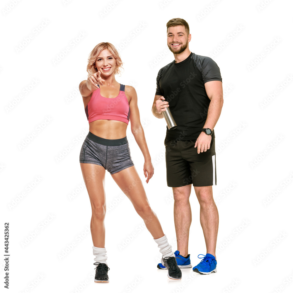 Full photo of young couple working out together on white background, spending time together, motivation Full photo of young couple working out together on white background, spending time together, motivation