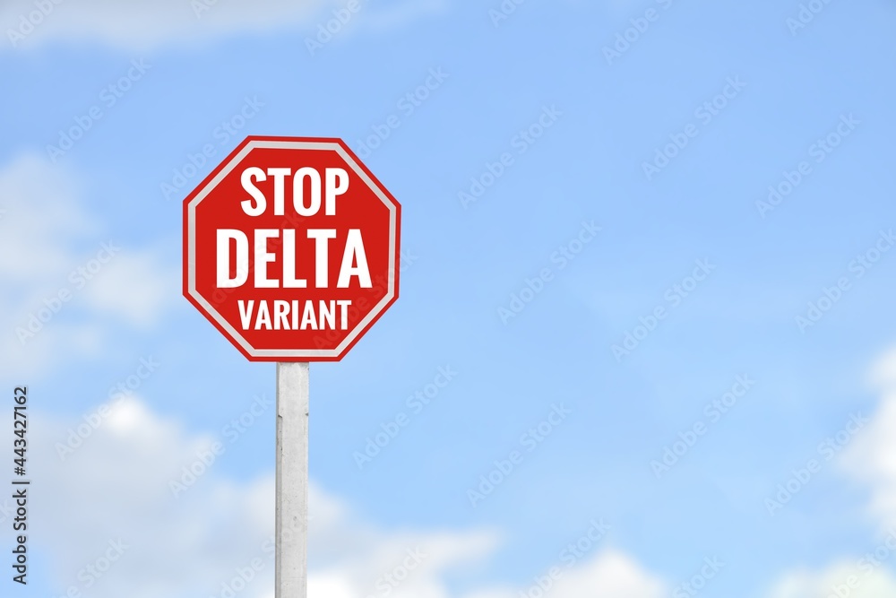 Red label on pole with texts ‘Stop Delta Variant’, concept for calling all people to stop spreading delta coronavirus variant around the world.
