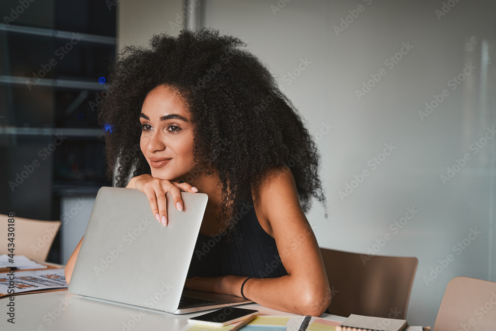 Dreamy lady at her workplace at the end of the day Dreamy lady at her workplace at the end of the day
