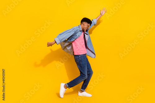 Full length photo of afro american young happy man dance enjoy free time isolated on yellow color background