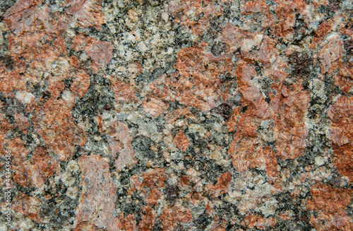 Natural texture of gray and red granite stone. Construction material 