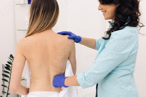 Physiotherapy Improves the Patient's Quality of Life. Doctor Collects a Complete Medical History of Back Problems and Performs a Detailed Physical Examination.