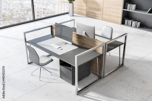 Bright coworking office interior with concrete floor, windows with panoramic city view and workplace furniture. Corporate workspace concept. 3D Rendering.