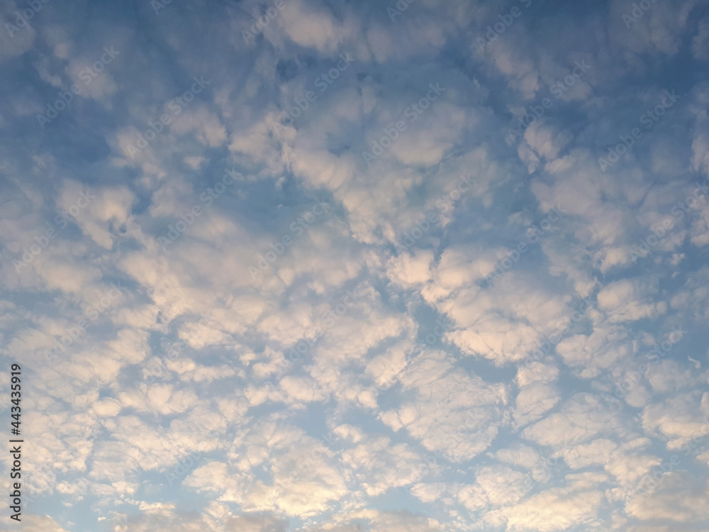 Unusual frequent clouds at sunset, light tone background