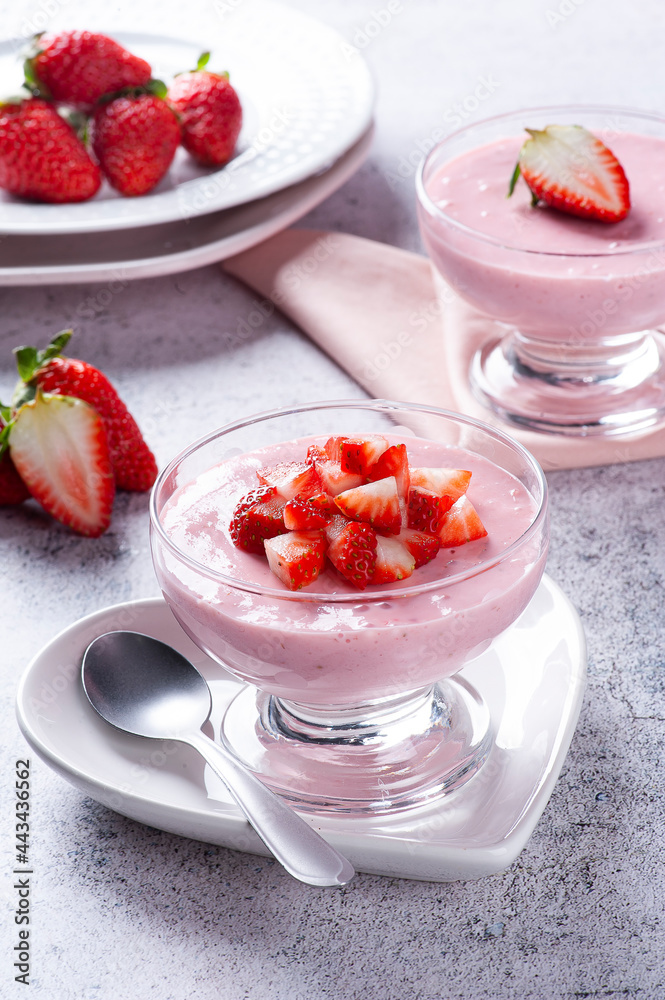 Delicious strawberry mousse in glass bowl with fresh strawberries. Delicious strawberry mousse in glass bowl with fresh strawberries.