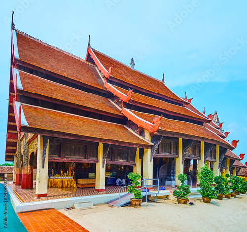 Three-tired pyathat roof of Viharn Luang in Wat Phra That Lampang Luang Temple, Lampang, Thailand photo