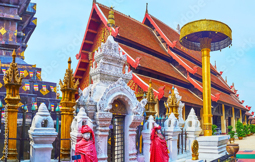 The Viharn Luang behind the chatra umbrella, Wat Phra That Lampang Luang Temple, Lampang, Thailand photo