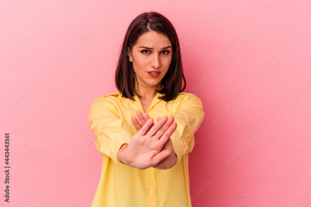 Young caucasian woman isolated on pink background doing a denial gesture Young caucasian woman isolated on pink background doing a denial gesture
