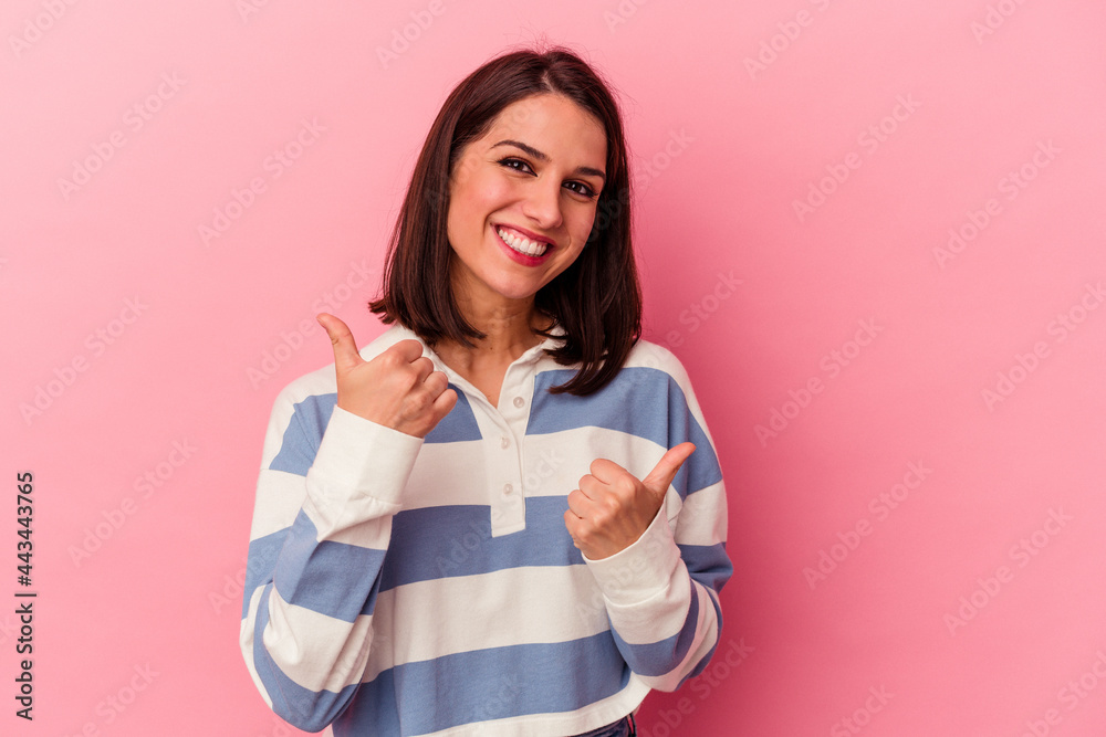 Young caucasian woman isolated on pink background raising both thumbs up, smiling and confident. Young caucasian woman isolated on pink background raising both thumbs up, smiling and confident.