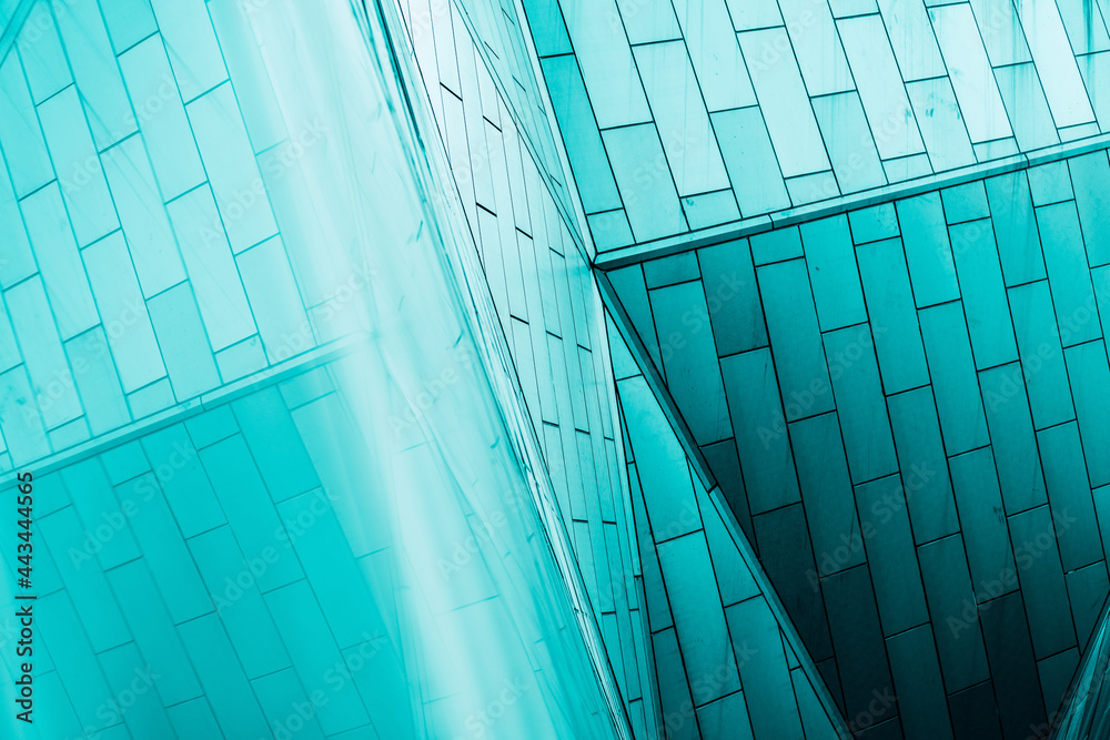 Obraz premium underside panoramic and perspective view to steel blue glass high rise building skyscrapers, business concept of successful industrial architecture