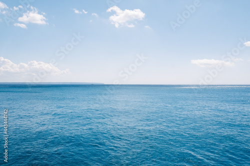 Turquoise mediterranean sea landscape with blue sky with some clouds on a sunny summer day