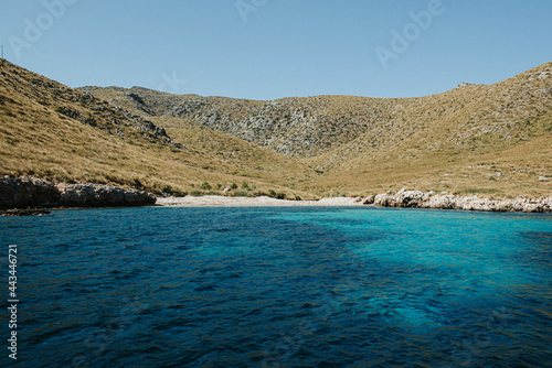 Mallorca beach in the middle of the mountains viewed from the turquoise Mediterranean sea