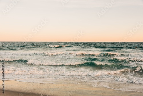 Waves crashing on a beach, Rockaways, Queens, New York City photo