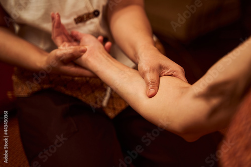 Masseur giving massage to client in cozy salon © Viacheslav Yakobchuk