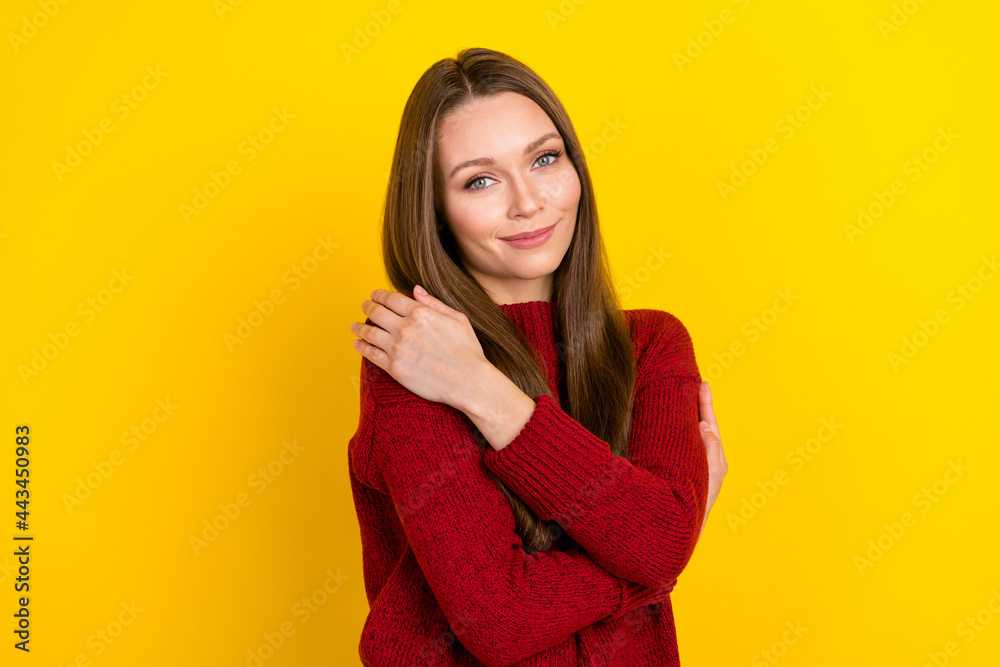 Photo of sweet brunette hairdo young lady hug herself wear red sweater isolated on vivid yellow color background Photo of sweet brunette hairdo young lady hug herself wear red sweater isolated on vivid yellow color background