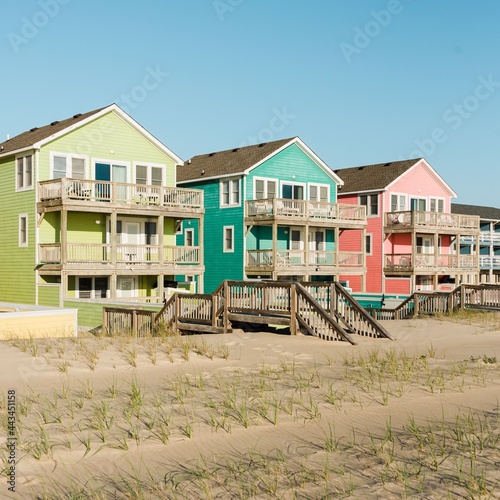 A row of houses on a beach, Outer Banks, North Carolina © jonbilous