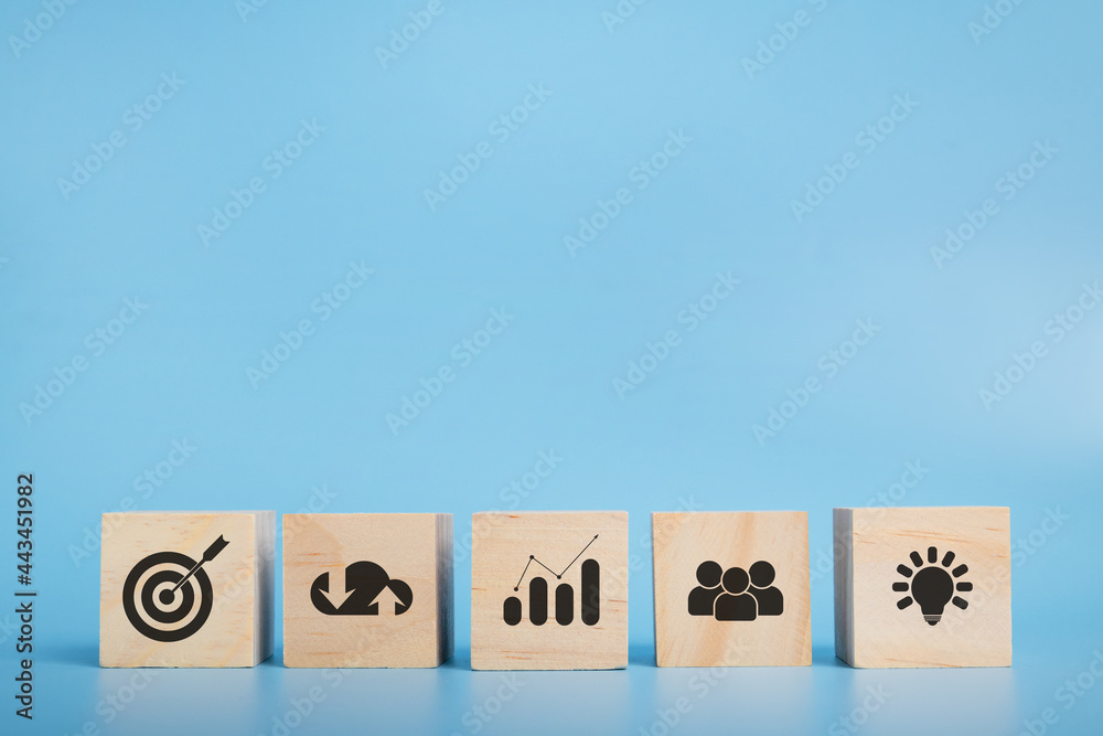 Wood block with icon business target and action plan.success and target concept. Wood block with icon business target and action plan.success and target concept.