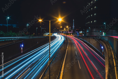 Autobahn 100 in the direction of Messedamm Berlin at night with lightrails, Highway 100 in Berlin germany, lighttrails, Radio Tower Berlin in Background