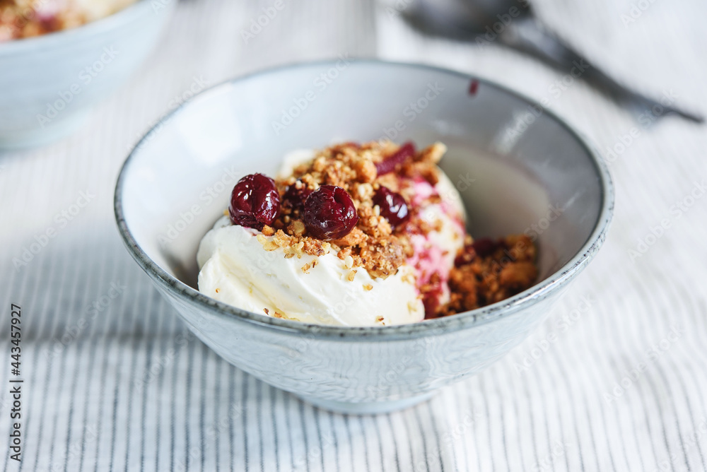 Cherry sauce, cream cheese and feta cream and crumble crust dessert. Homemade Sweet and salty cheesecake. Trifle. Selective focus Cherry sauce, cream cheese and feta cream and crumble crust dessert. Homemade Sweet and salty cheesecake. Trifle. Selective focus