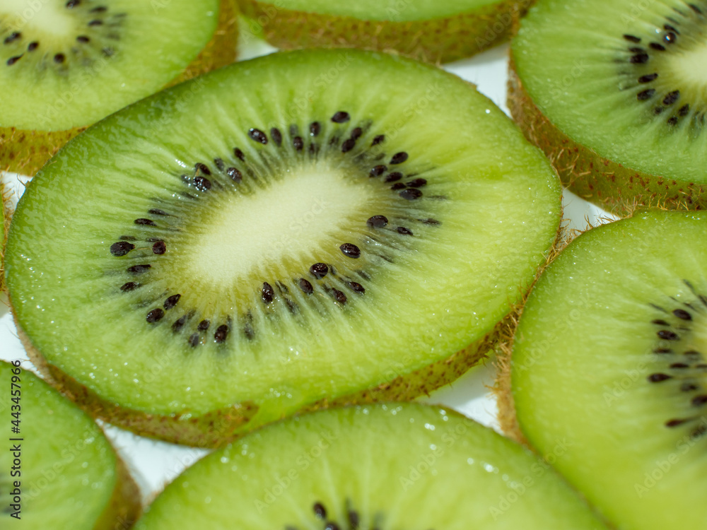 Kiwi sliced into slices isolated on white background. Kiwi sliced into slices isolated on white background.