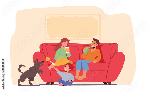 Kids Fun at Home Concept. Little Children with Soda Drink Sitting on Sofa Drinking Beverages and Playing with Dog