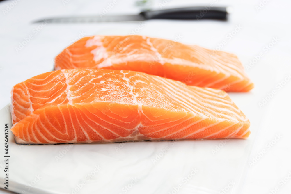 Fresh salmon fillet on marble plate for delicious salmon steak. Fresh salmon fillet on marble plate for delicious salmon steak.