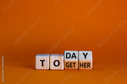 Today we are together symbol. Turned wooden cubes and changed the word together to today. Beautiful orange background, copy space. Business and today we are together concept.