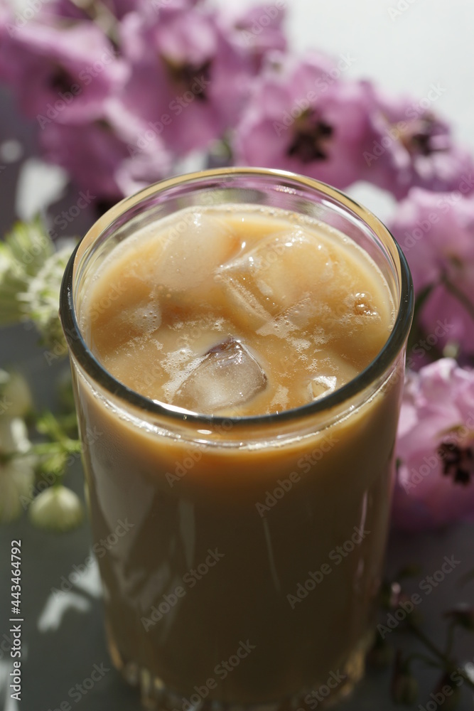 Iced coffee with ice in a tall glass Iced coffee with ice in a tall glass