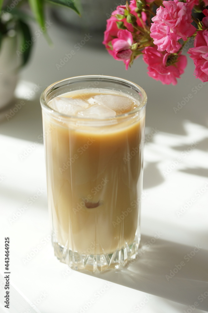 Iced coffee with ice in a tall glass Iced coffee with ice in a tall glass