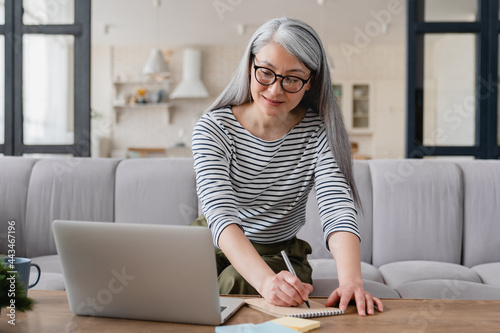 Photography Mature businesswoman freelancer female tutor lecturer teacher preparing for less