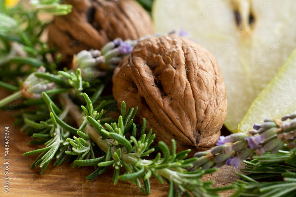 Fototapeta premium Close up of a walnut with pears and rosemary