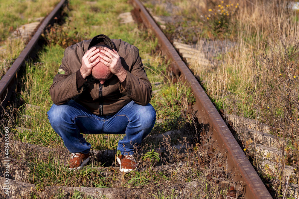 man, rails. upset person
