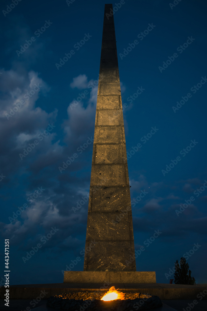 Monument to the Unknown Soldier with eternal fire in the evening. War memorial located in the Ukrainian capital of Kyiv. Park of Eternal Glory. Ukraine Monument to the Unknown Soldier with eternal fire in the evening. War memorial located in the Ukrainian capital of Kyiv. Park of Eternal Glory. Ukraine
