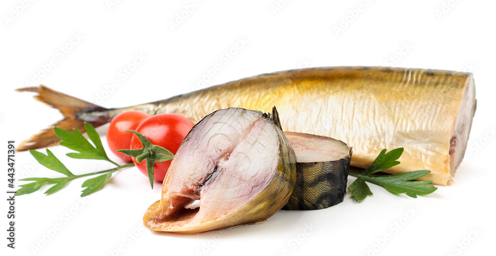 Smoked mackerel whole and pieces with herbs on a white background. Isolated Smoked mackerel whole and pieces with herbs on a white background. Isolated