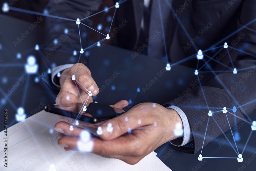 Hands of hr specialist browsing social networks in the Internet in smart phone to find the best candidates to hire international team. Concept of success. Media hologram icons. Formal wear.