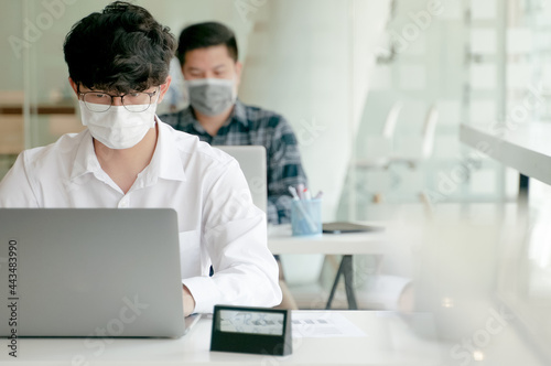 Coronavirus. Business workers wearing protective mask. working together at office.