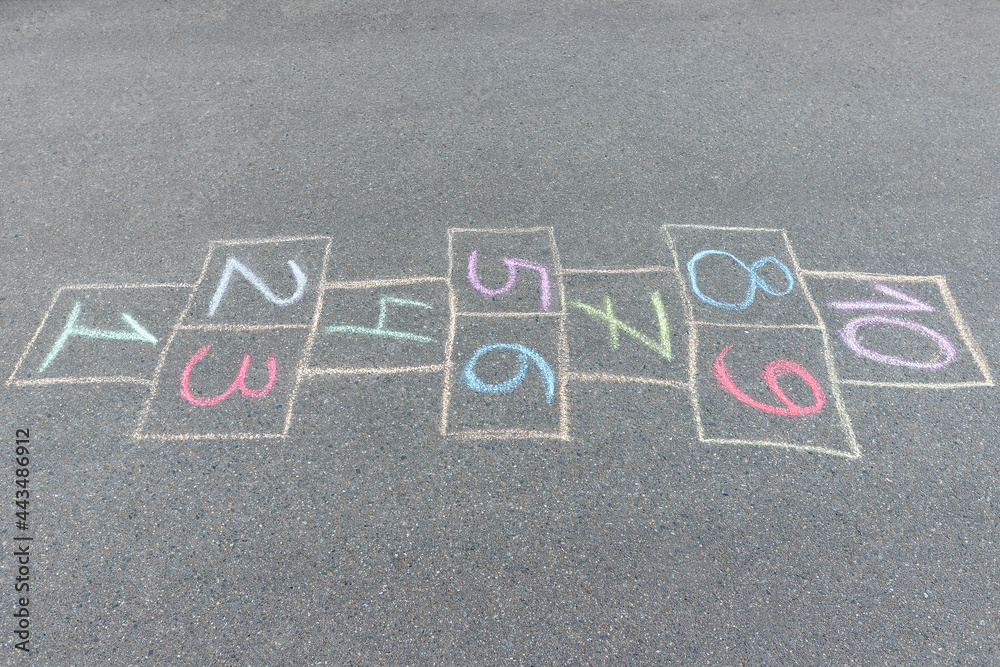 Close-up photo of chalk painted hopscotch on asphalt. School yard. Back to school. - obrazy, fototapety, plakaty 