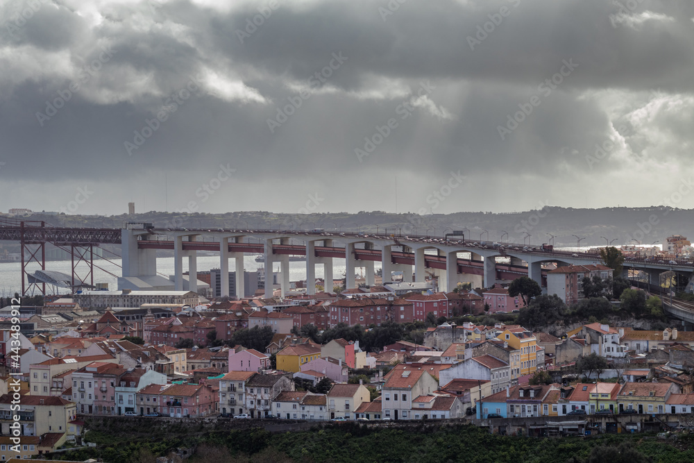 Panoramic view of Lisbon city in winter day with 25 de Abril bridge in the background.