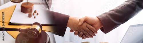 Business and lawyers discussing contract papers with brass scale on desk in office. Law, legal services, advice, justice and law concept picture with film grain effect