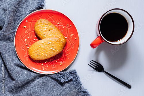 Bosnian and Turkish dessert called Hurmasica served on a grey background with cup of coffee photo