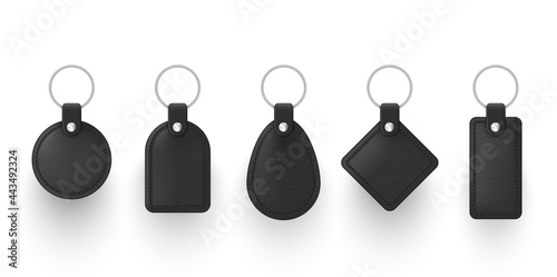 Realistic black leather keychains with metal ring vector illustration. Set of holder trinket to key photo