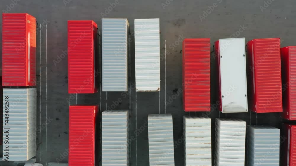Cargo (freight) shipping containers stand on warehouse parking lot in a