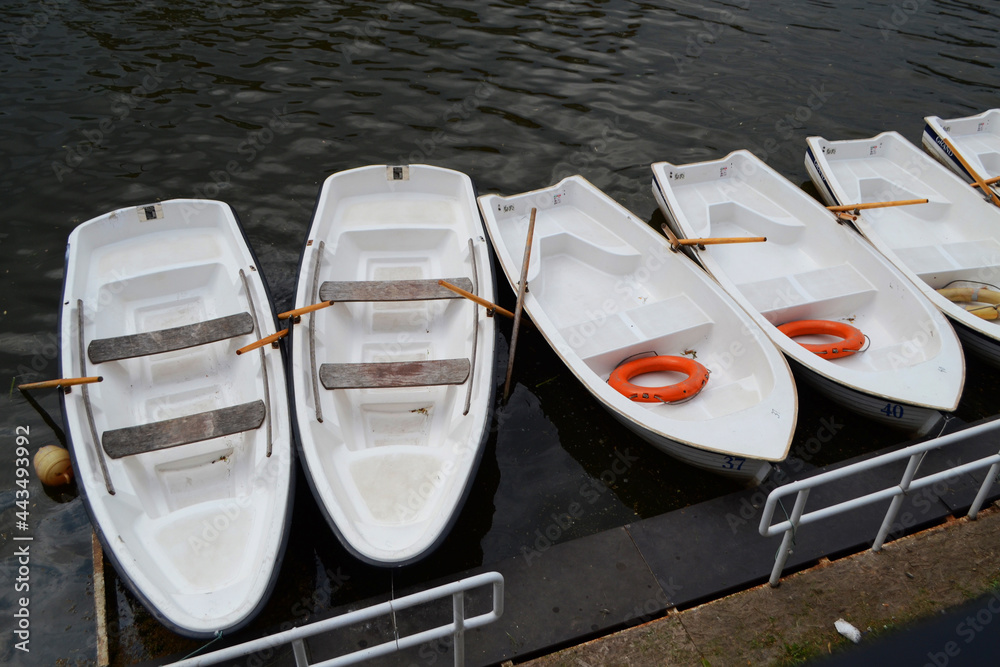 Boat for a walk on the river, boat station, boats in a row. Boat for a walk on the river, boat station, boats in a row.