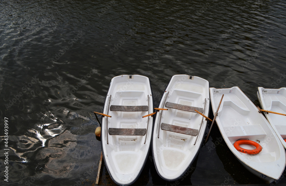 Boat for a walk on the river, boat station, boats in a row. Boat for a walk on the river, boat station, boats in a row.