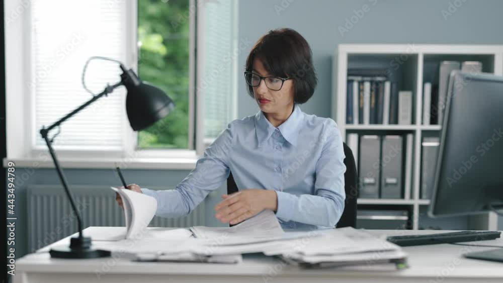 Office worker searching documents Office worker searching documents