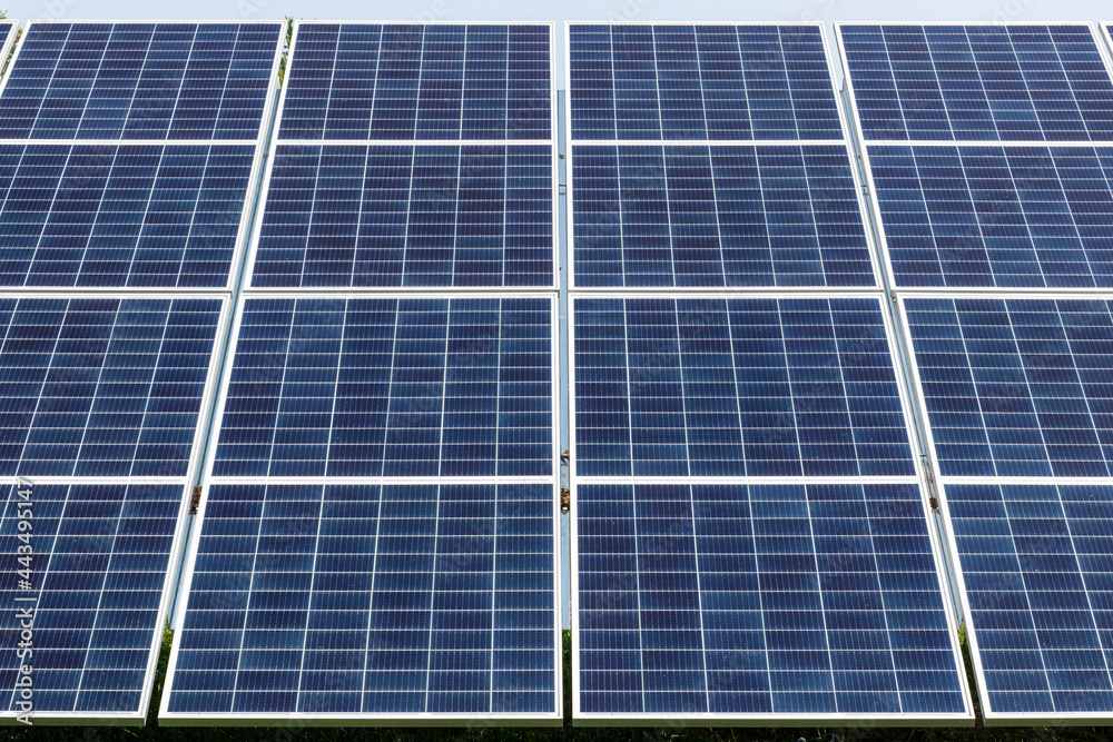 Solar Thermal Flat Panels in a residential neighborhood. Residents are installing renewable energy sources to reduce their carbon footprint. Solar Thermal Flat Panels in a residential neighborhood. Residents are installing renewable energy sources to reduce their carbon footprint.