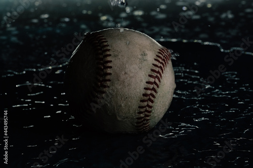Photography Moody baseball background with used ball from game closeup in water